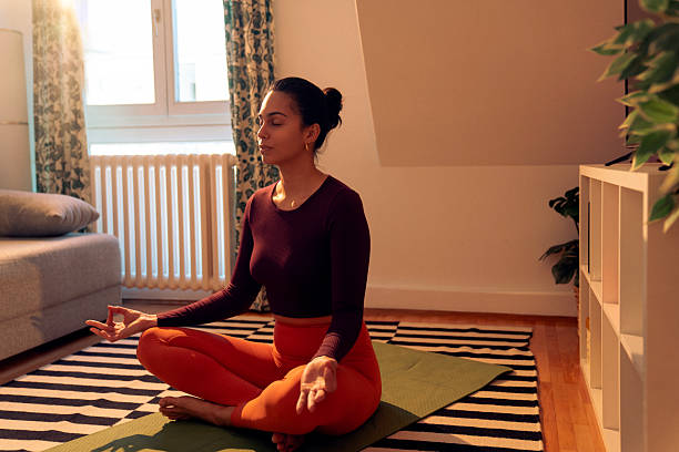 Peaceful evening breathing practice in a cosy living room