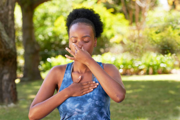Person practising controlled breath retention in a calm setting